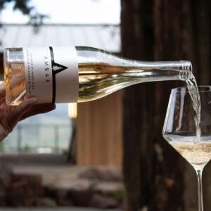 Ambar Estate rose being poured into a glass.